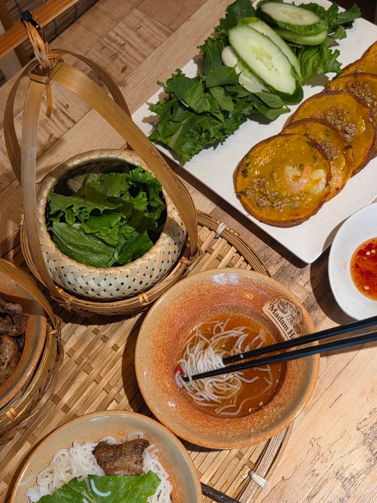 Vertical shot of the bun cha table setting at Madam Hao