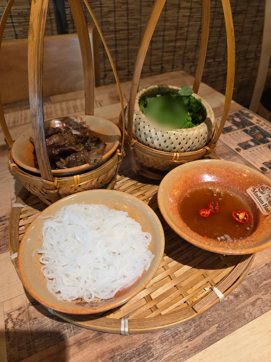 Bun cha served in bamboo rattan dishware