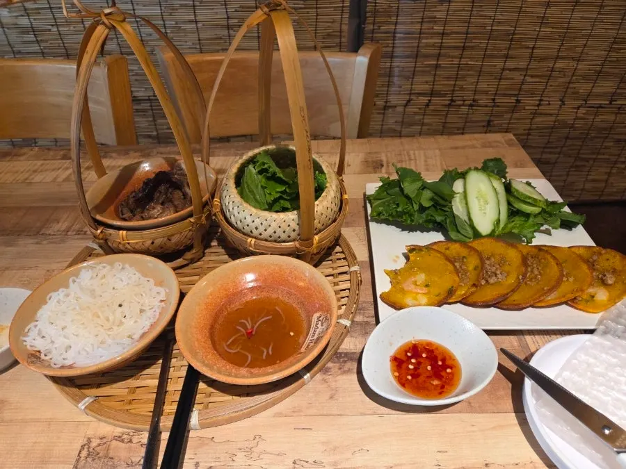 Bun cha and banh khot placed together on the table at Madam Hao