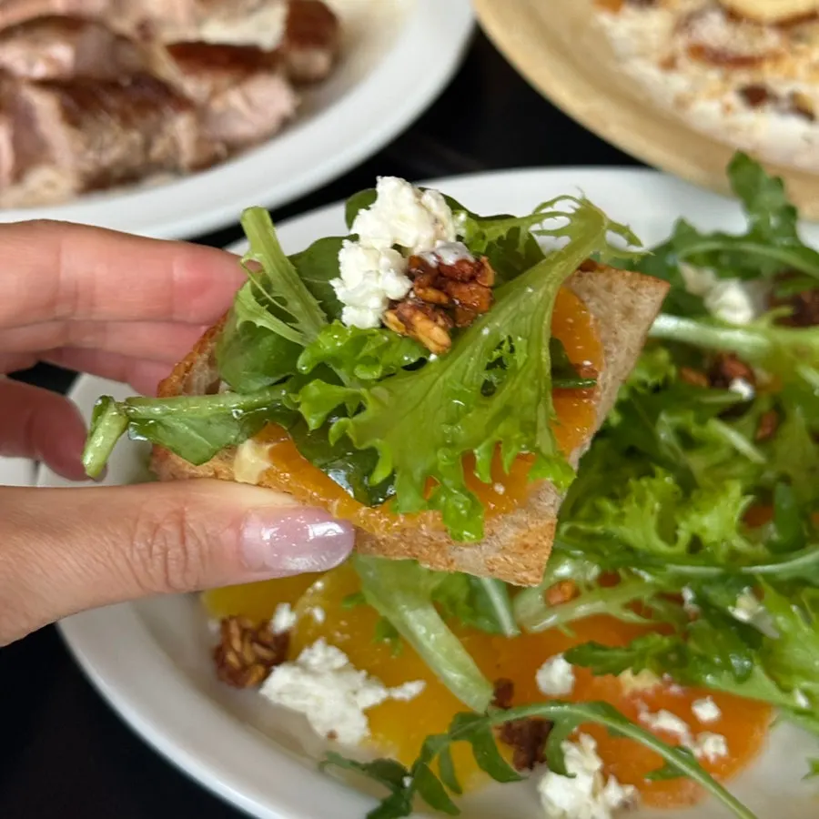 Salad piled on bread