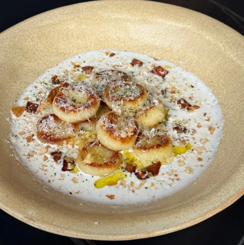 A plate of Allegro's mushroom cream potato gnocchi