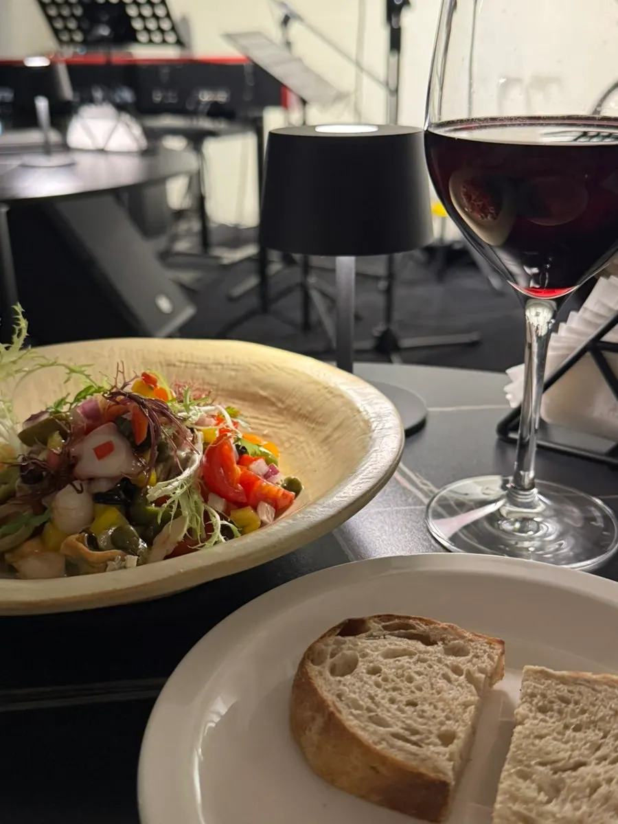Table set with pre-meal bread and wine