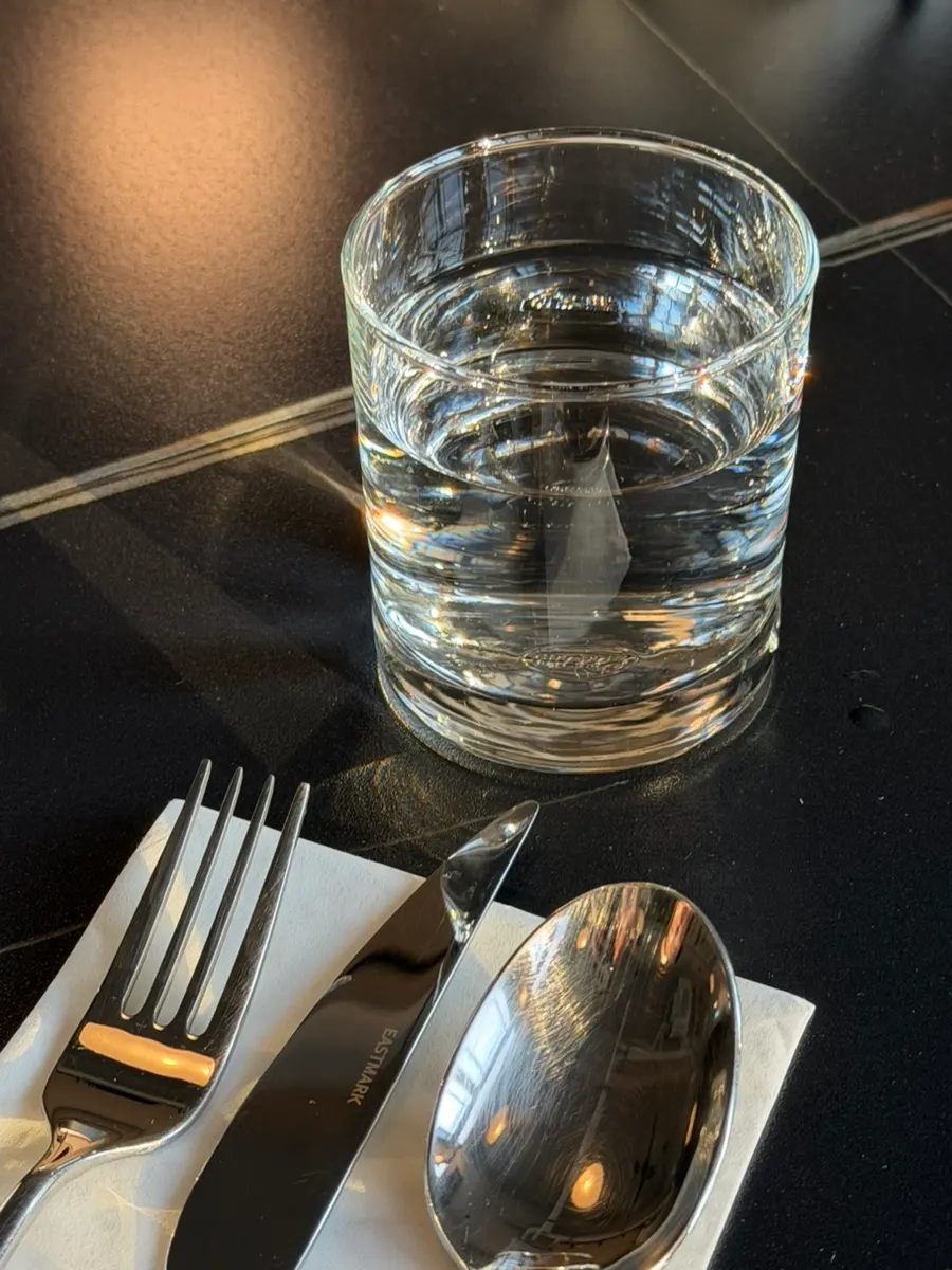 Allegro water glass reflecting the lighting