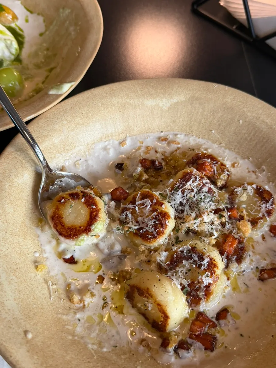 Close-up of gnocchi with rich cream sauce