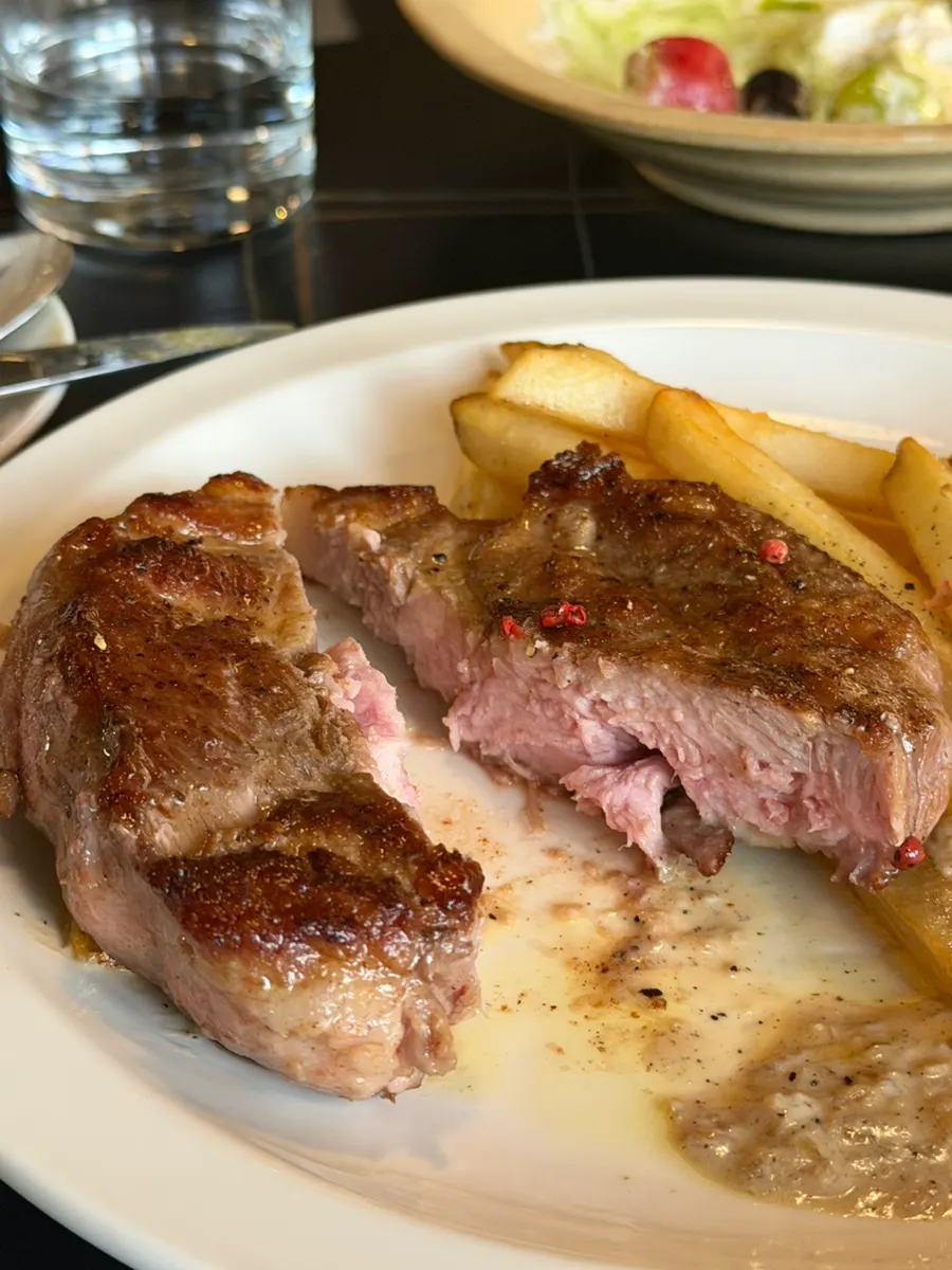 Thick sous-vide pork neck steak with fries