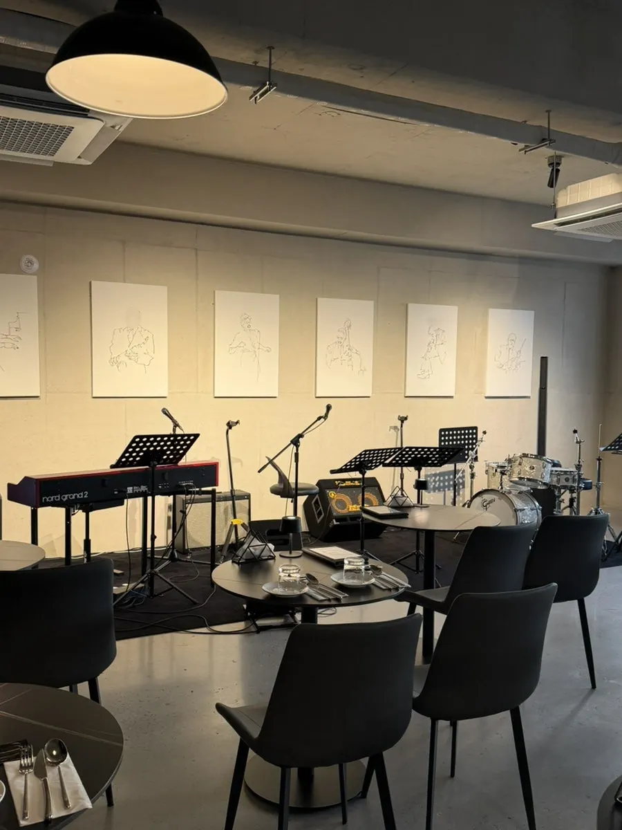 The stage where live shows happen and tables for two