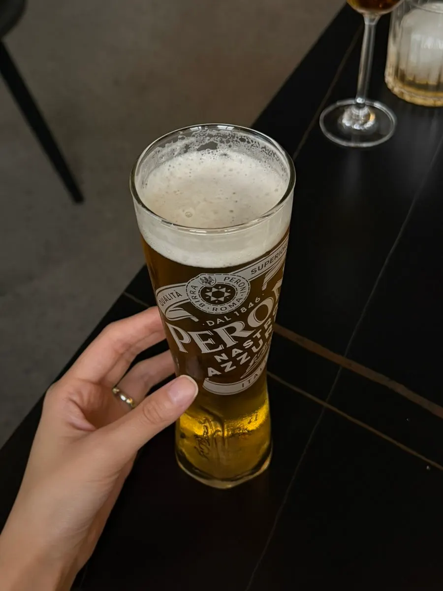 Peroni draft beer in a slim glass