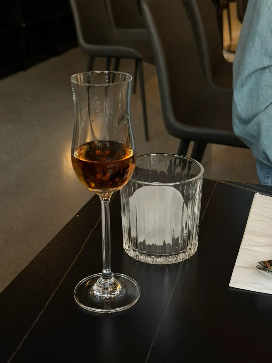 Whiskey served with a separate large ice cube