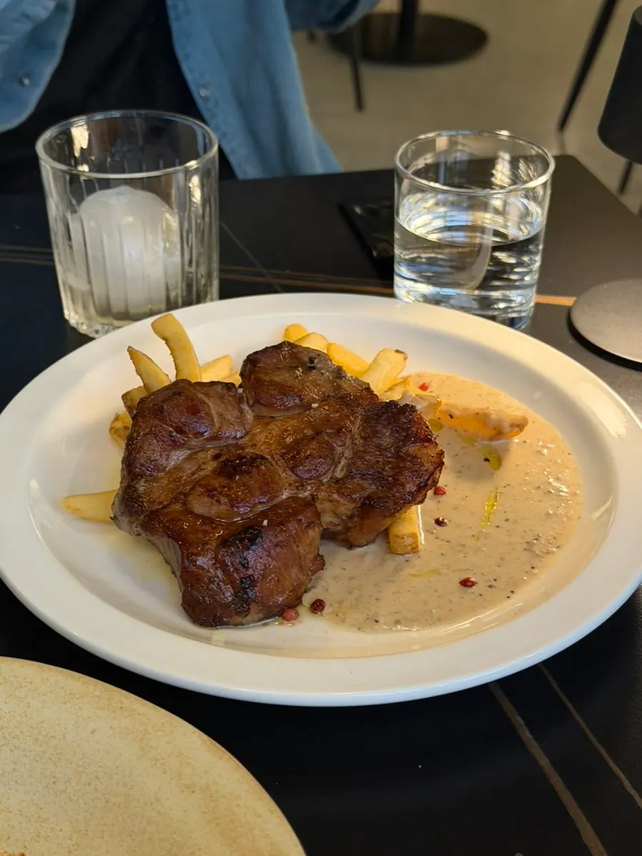 Speed pork neck steak served with fries