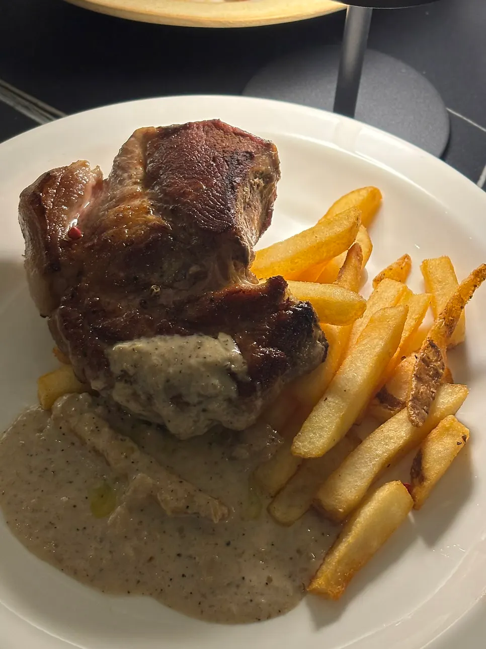 Sous-vide pork shoulder steak with peppercorn sauce