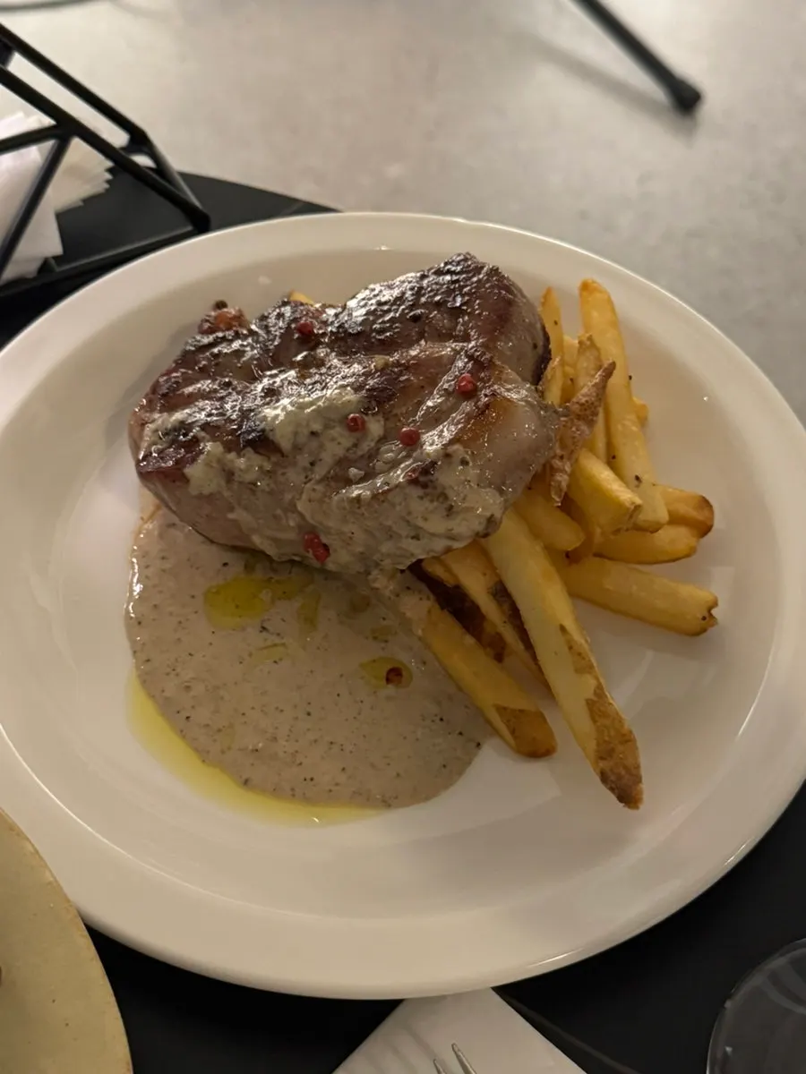 Pork neck steak with truffle sauce and fries