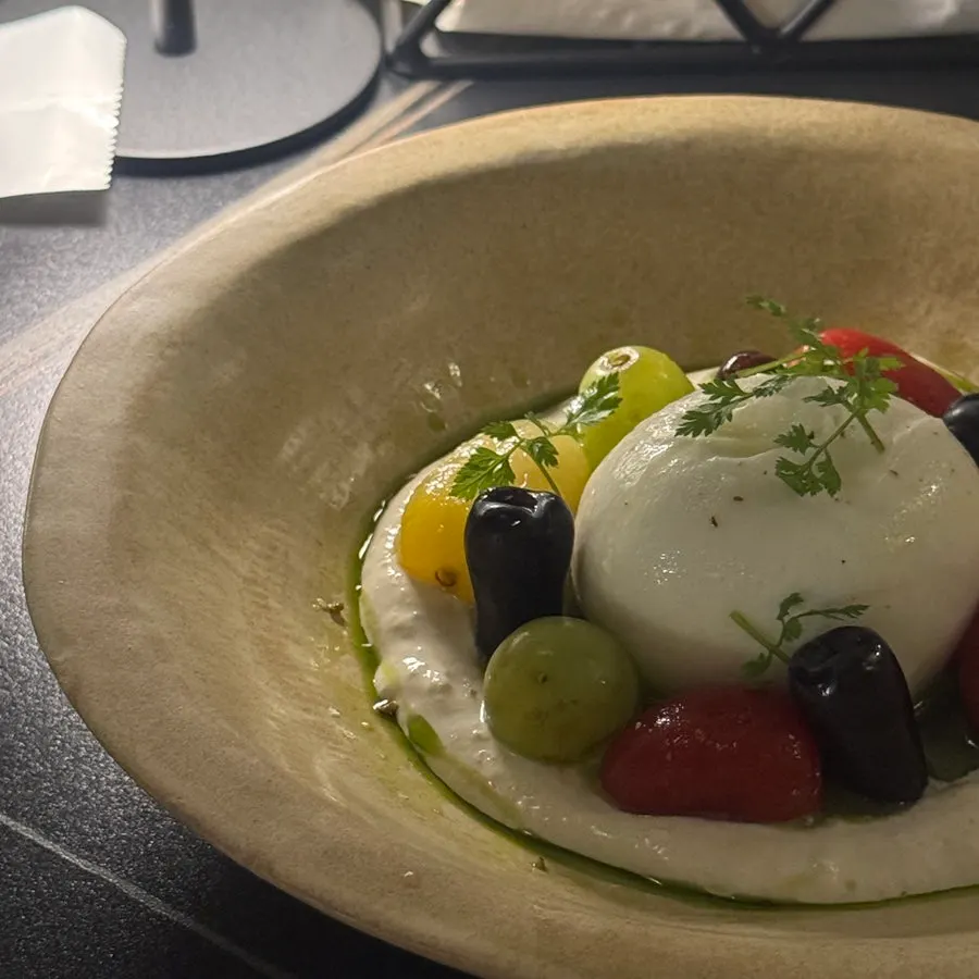 Burrata salad topped with Shine Muscat grapes and tomato