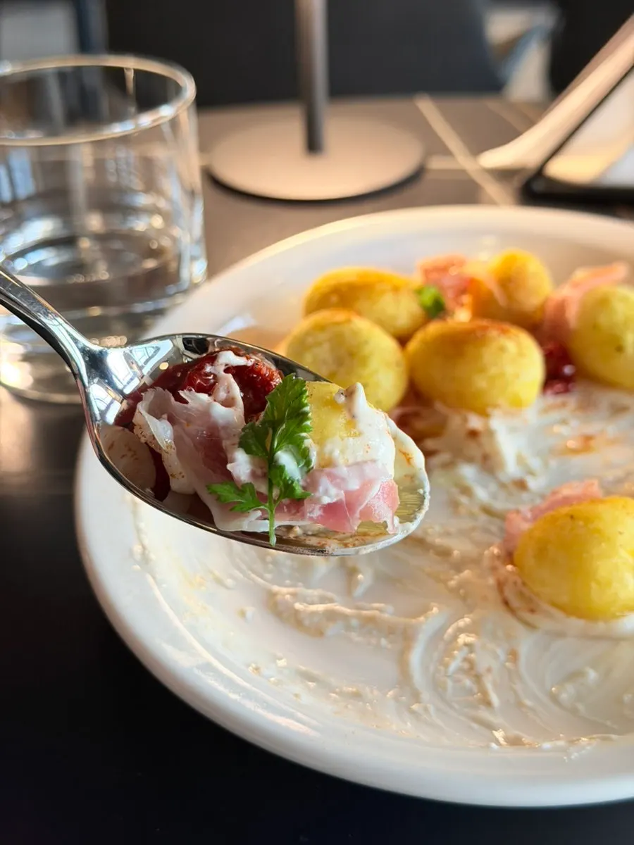 Prosciutto potato salad served as an appetizer