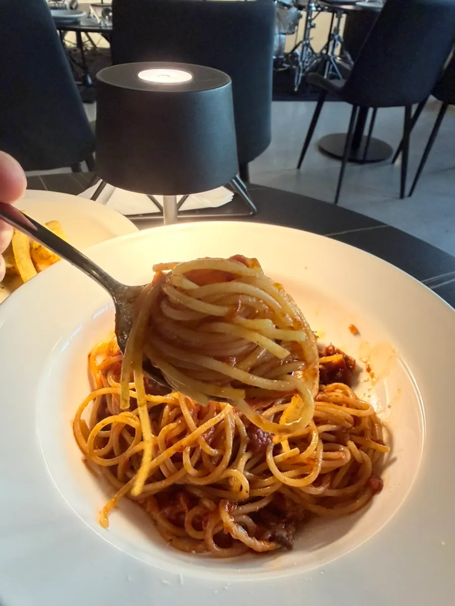 Plated amatriciana pasta at Allegro
