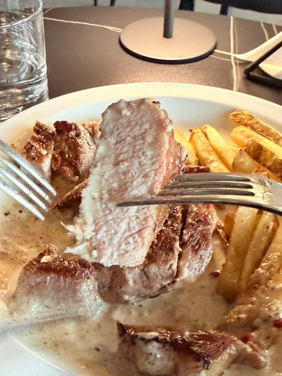 Cleanly plated sous-vide pork shoulder steak