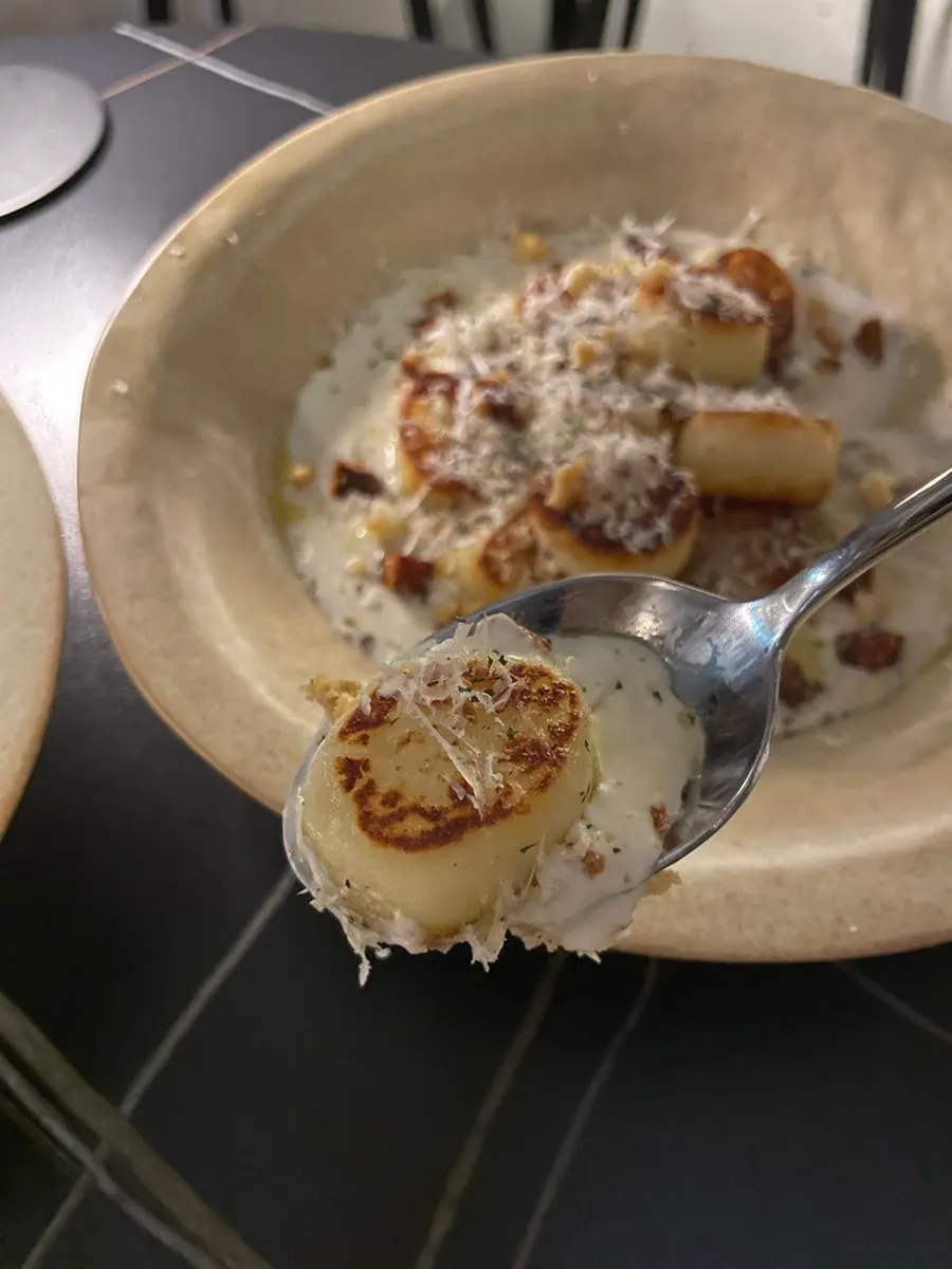 Cream potato gnocchi topped with crunchy bits