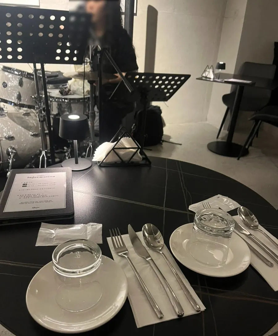 View of the stage from a hall side seat right in front of the drums