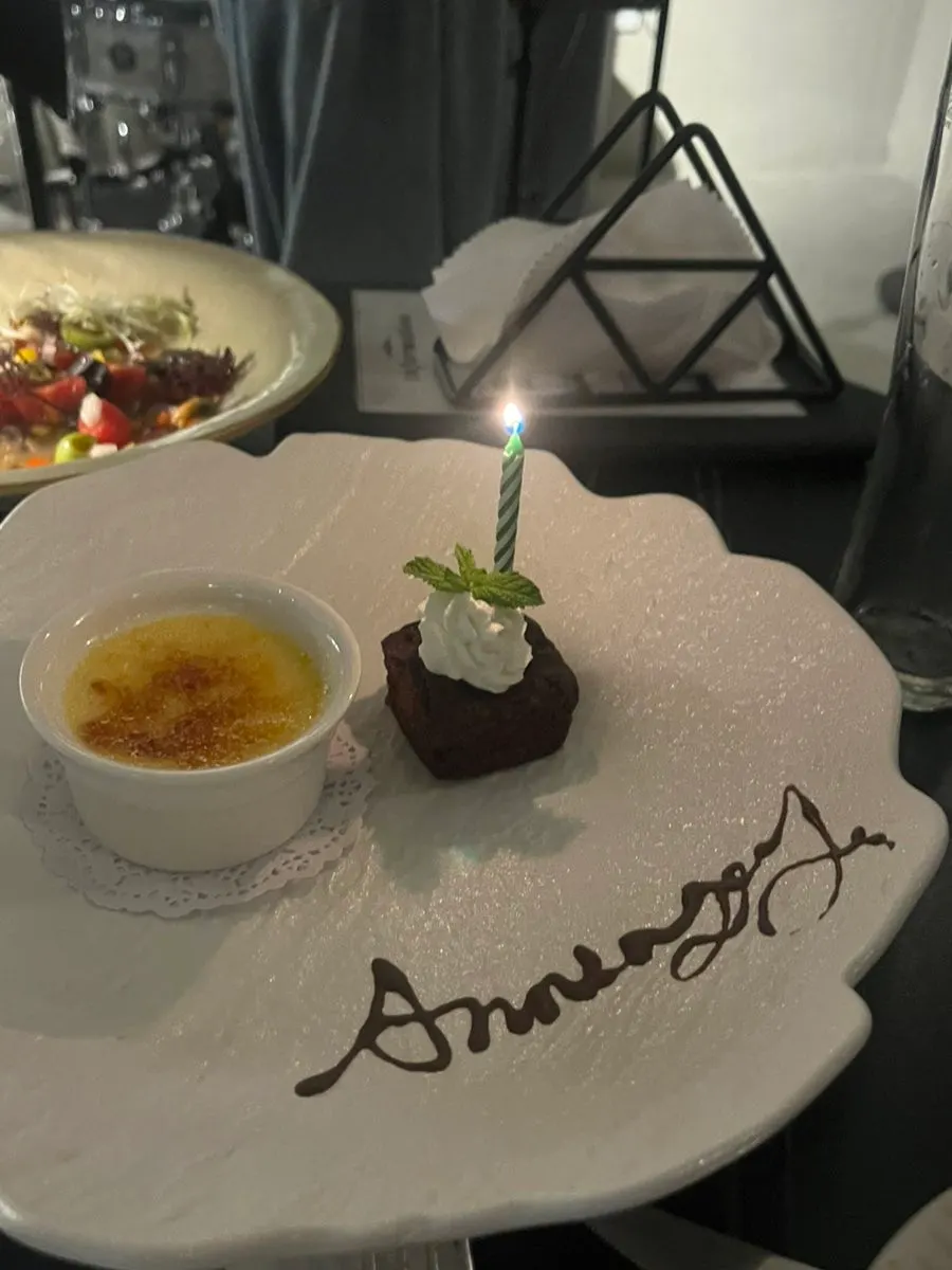 Anniversary crème brûlée and brownie with a mini candle