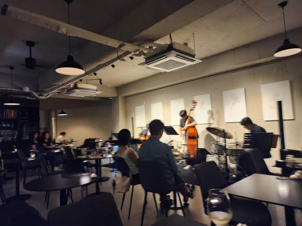 Lights gathering on Allegro's stage during a live jazz performance