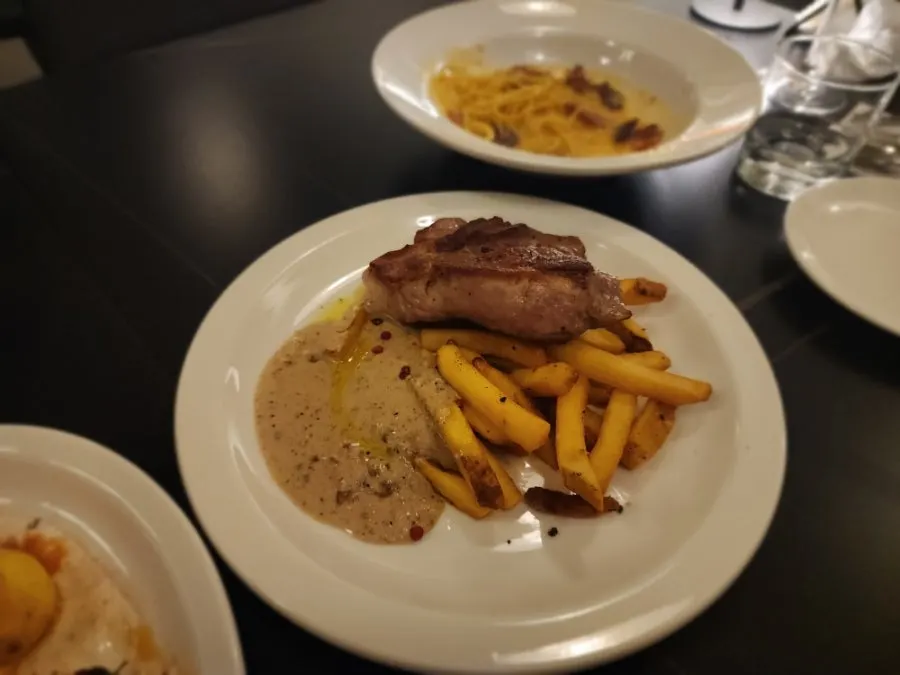 Close-up of the crispy seared crust on the pork shoulder steak