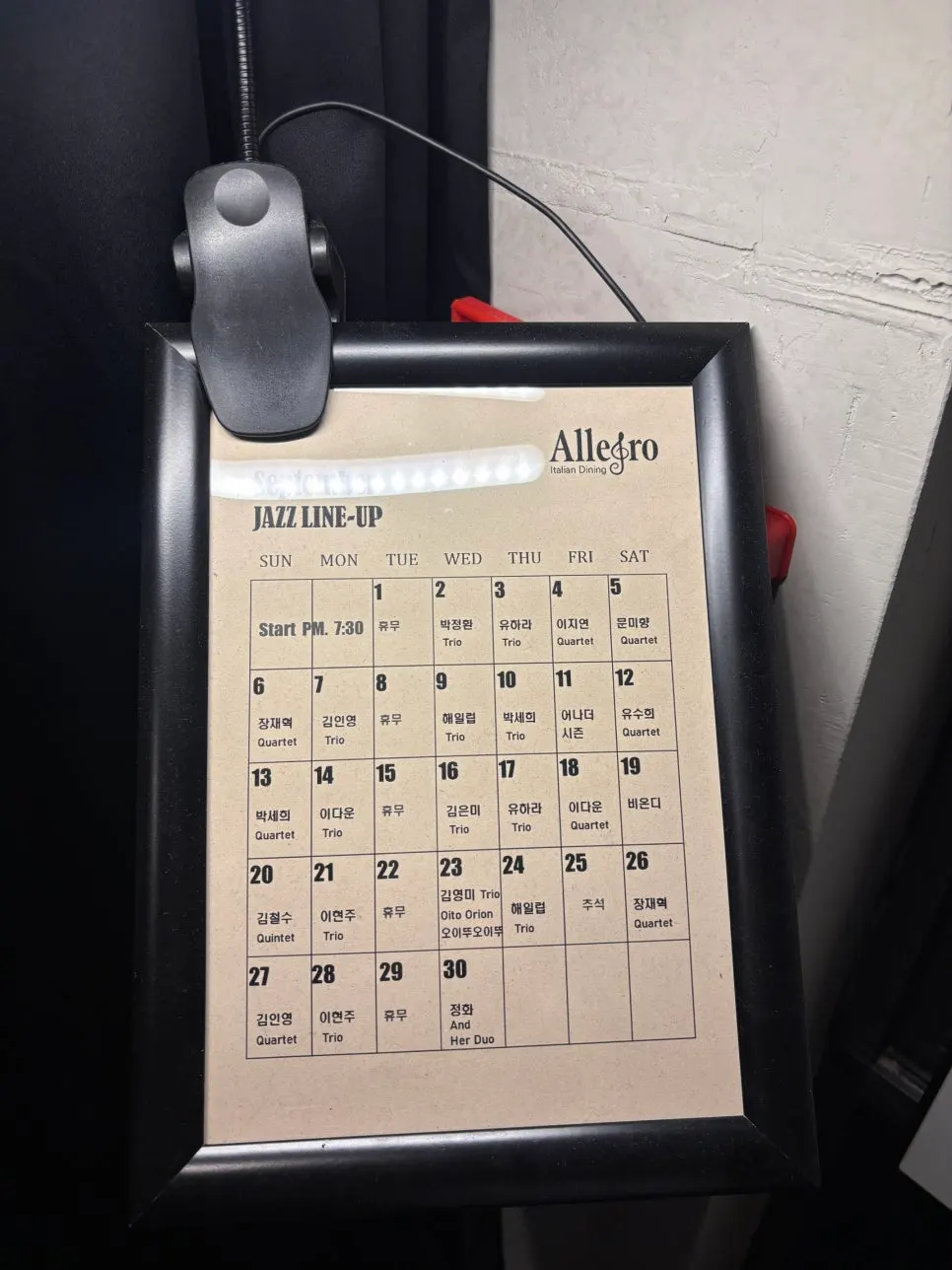 Sign showing Allegro's jazz show times and ticket prices