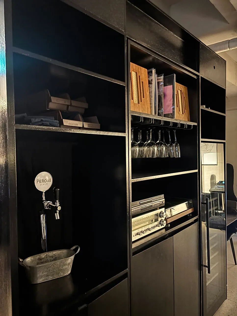 Liquor bottles and decor items on Allegro's shelves