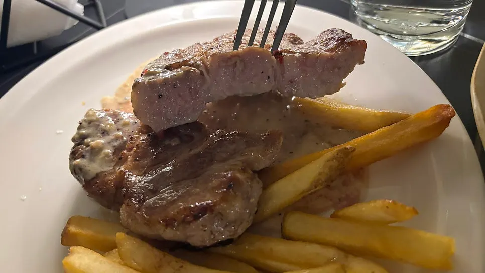Sous vide pork neck steak with its creamy sauce