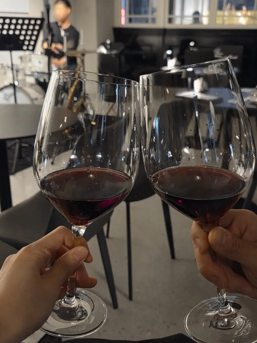 A glass of Cabernet Sauvignon poured by staff