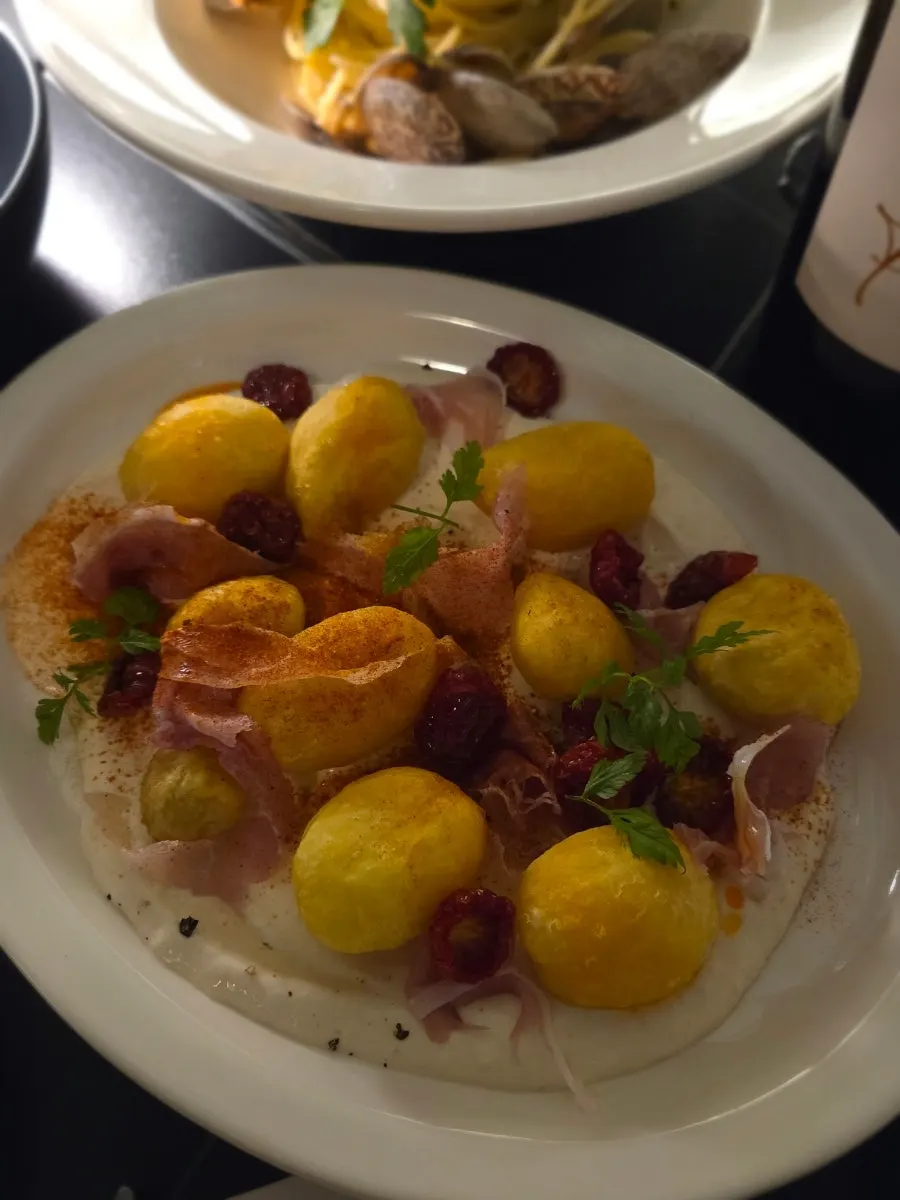 Piedmont-style potato salad topped with prosciutto