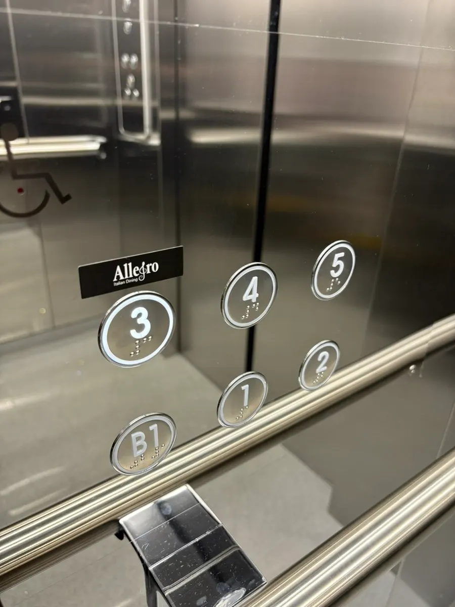 3rd floor entrance and elevator sign for the building where Allegro is located