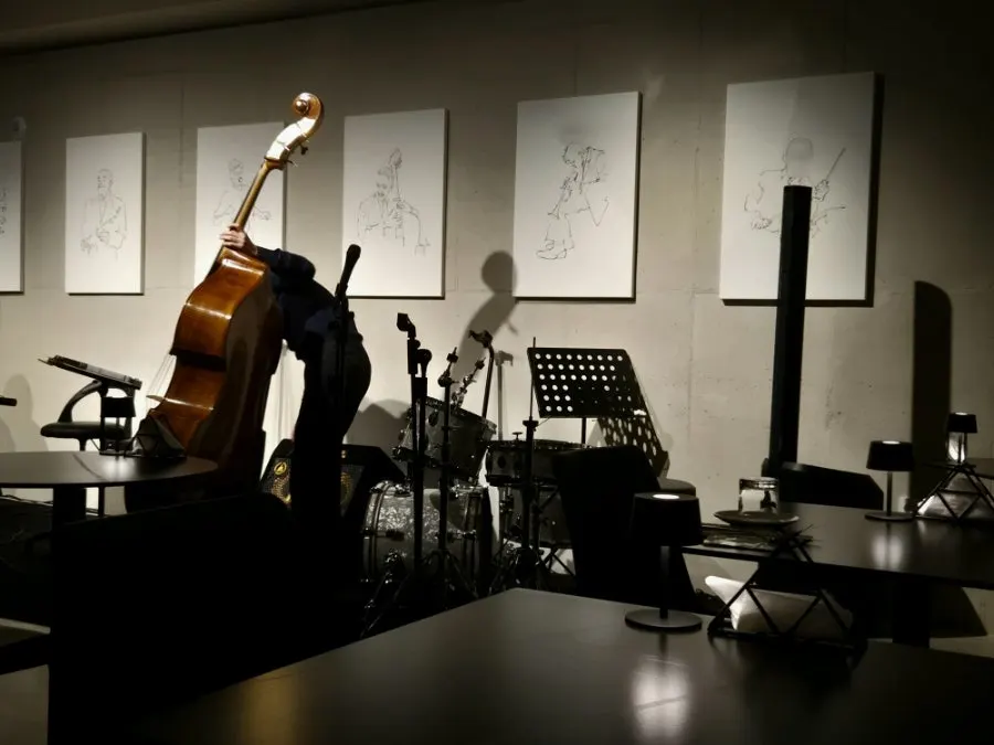 A table for two with a clear view of the bassist