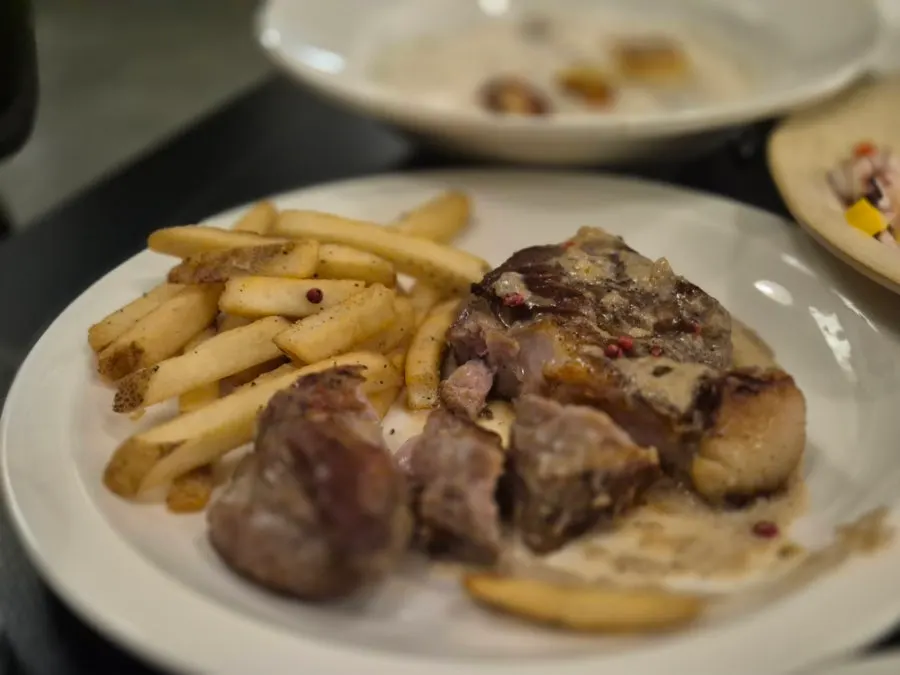 Close-up of the pork steak topped with sauce