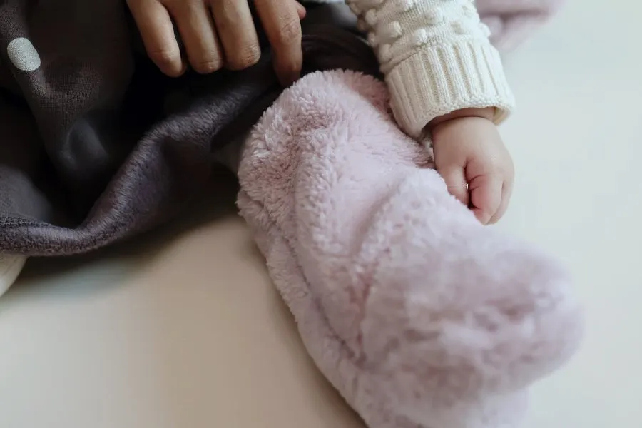 Baby foot warmers worn folded over