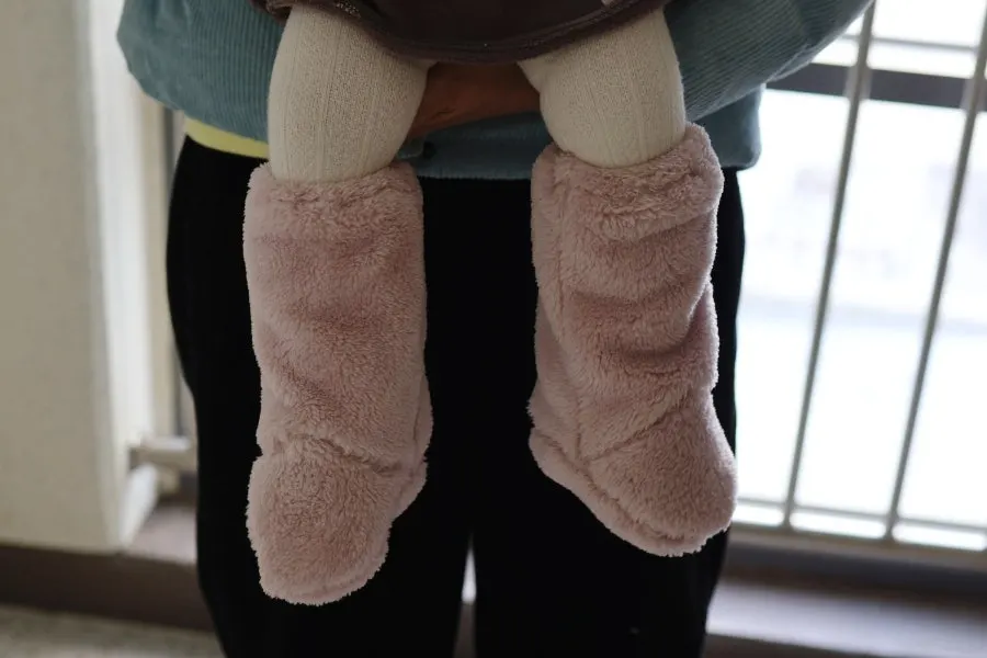 Baby winter foot warmers worn at home