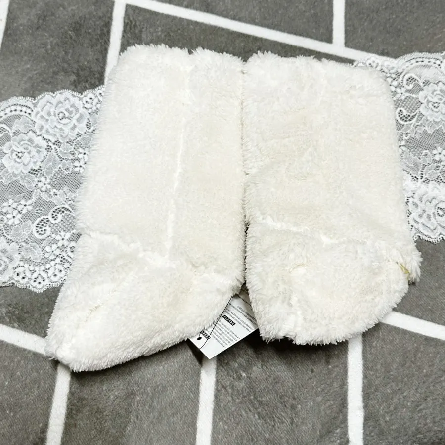 White baby foot warmers being worn