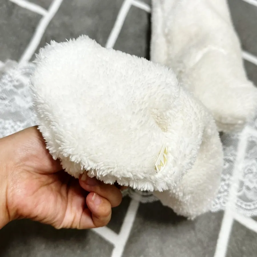 Baby wearing foot warmers