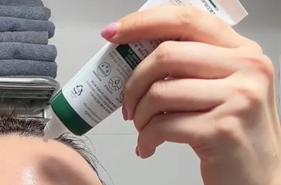 Moisturizing cream texture spread on the back of a hand