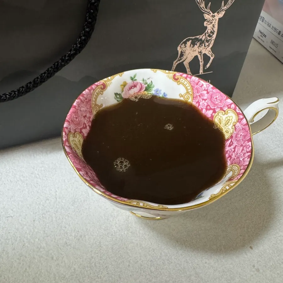 Deer antler drink transferred to a cup for warming