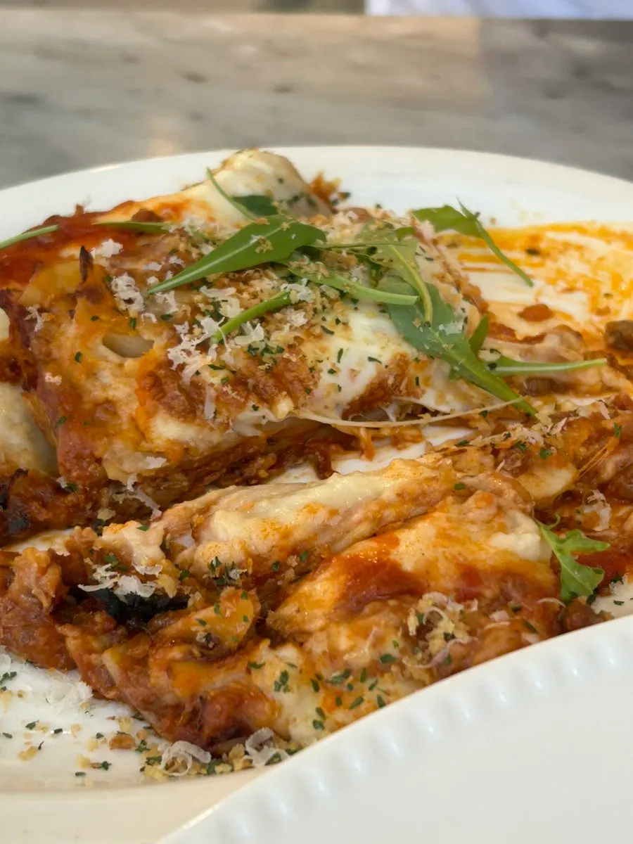 Cross-section of lasagna with stretching cheese