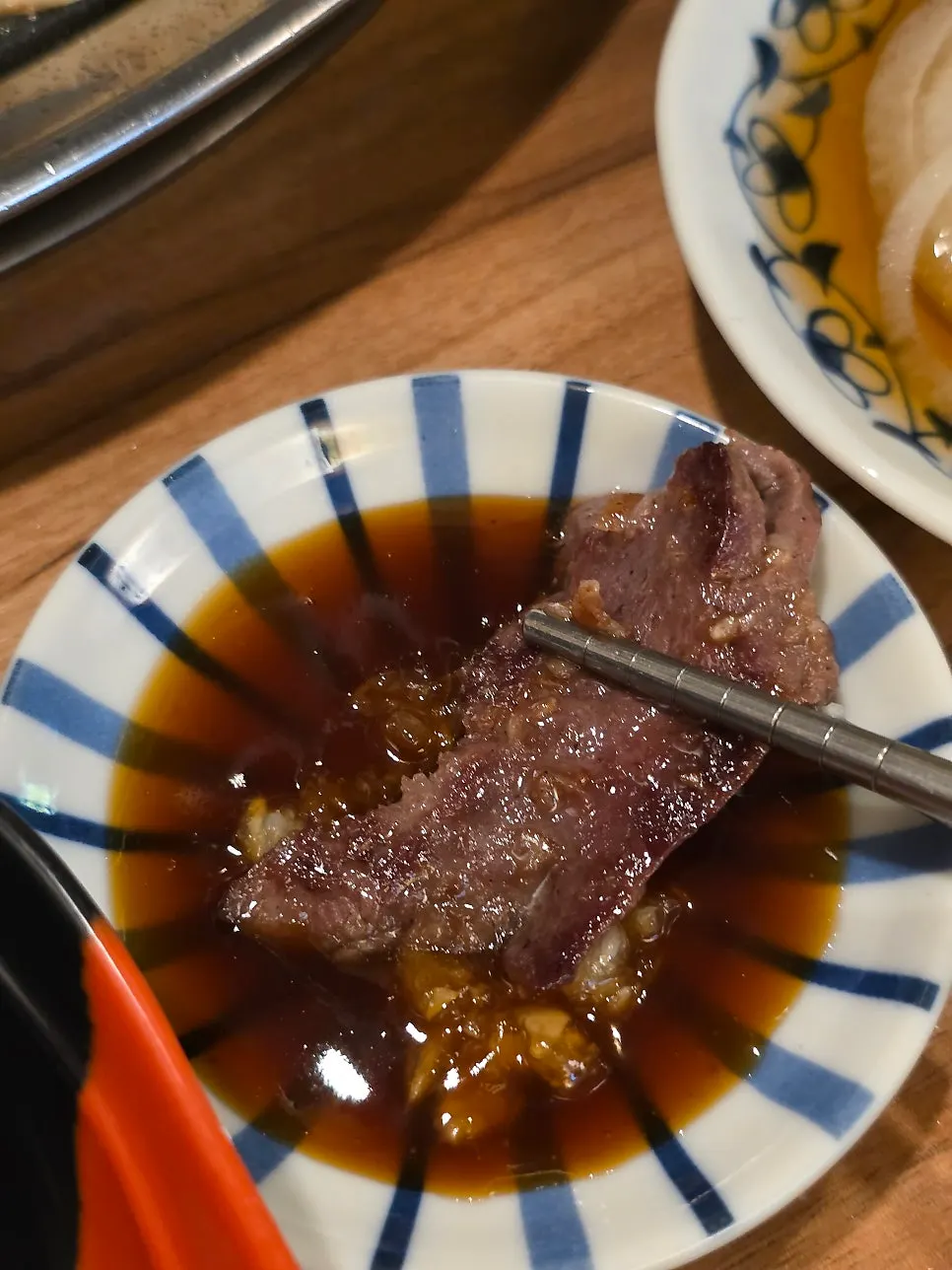 Beer glass next to the grill plate
