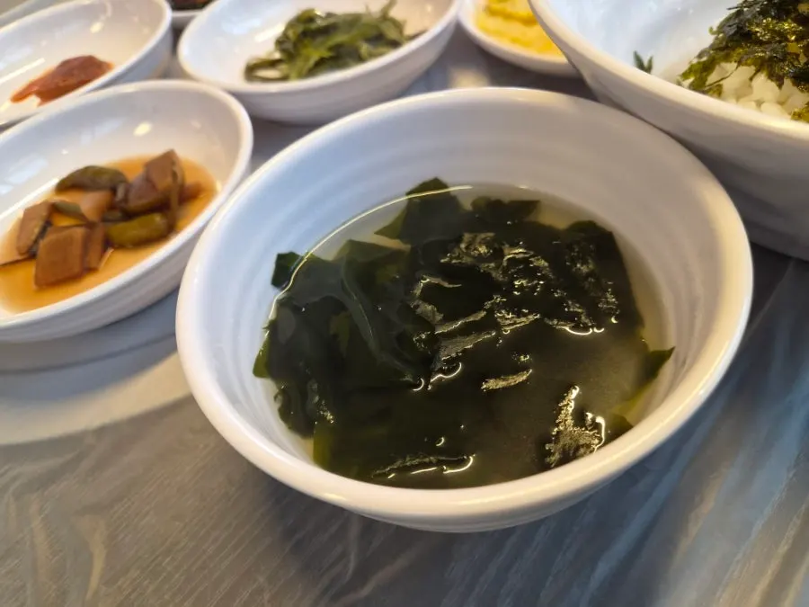 Bowl of daejeopbap topped with flying fish roe and seaweed flakes