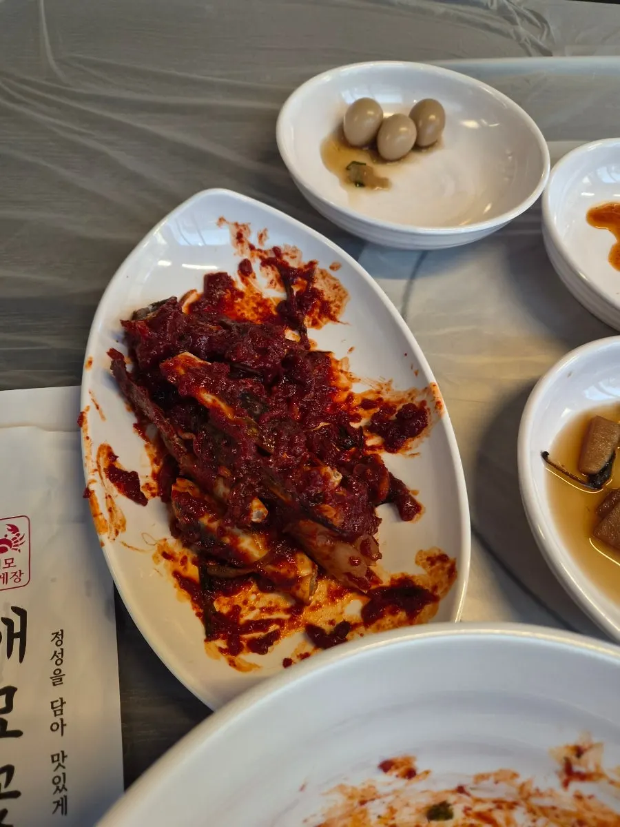Close-up of crab meat coated in red marinade