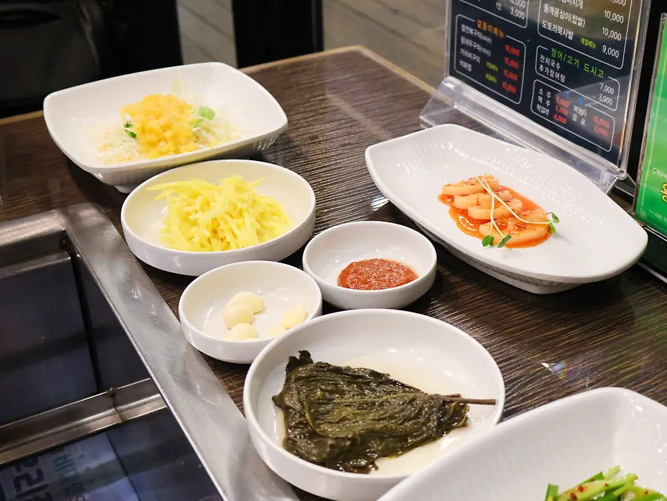 Plate of white kimchi and seasoned chives