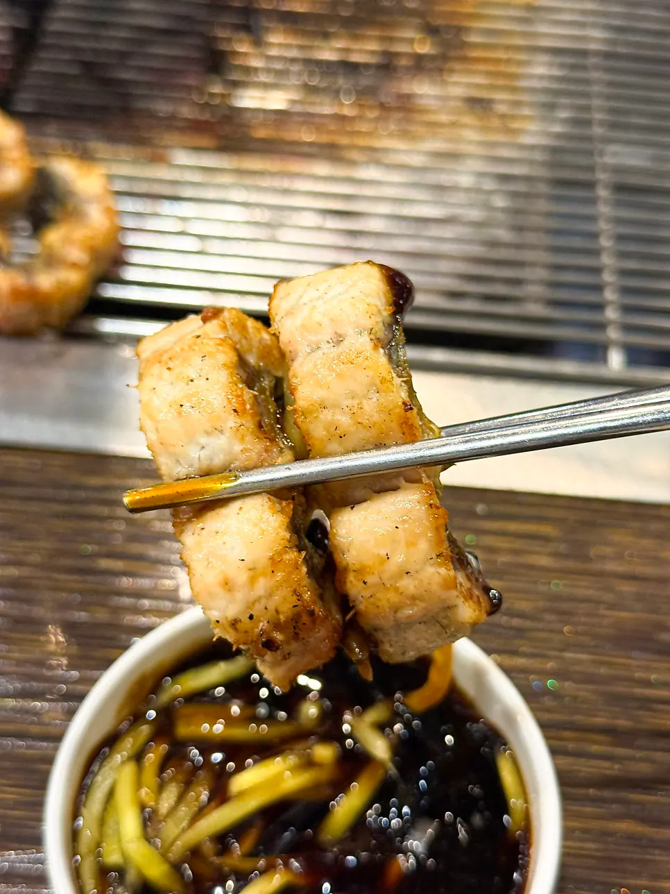 A thick piece of golden, perfectly grilled eel