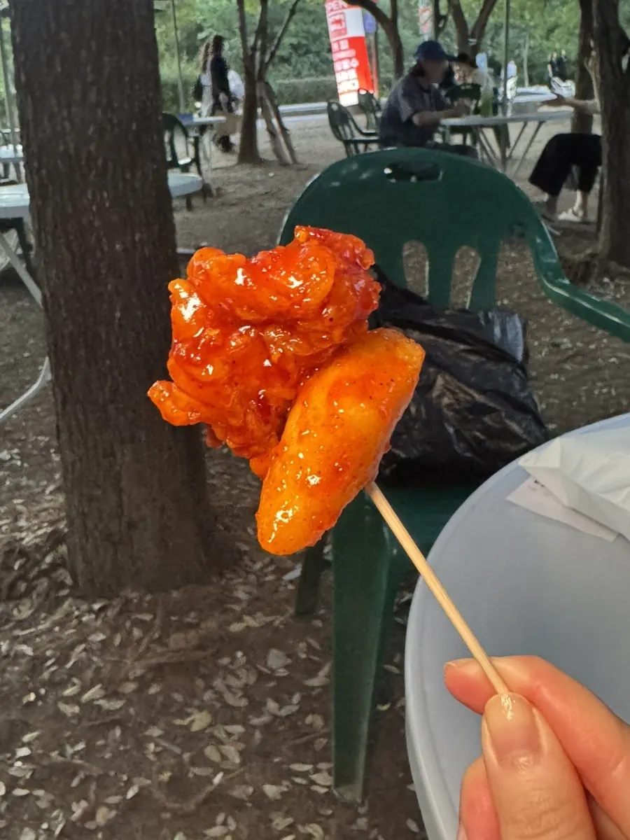 Close-up of ketchup-tinged dakgangjeong sauce