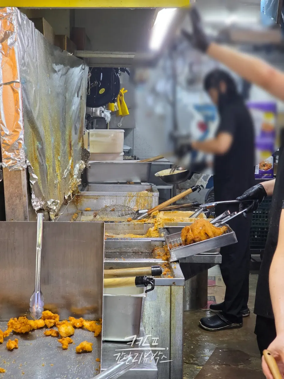 Inside the shop where chicken is being fried after orders come in