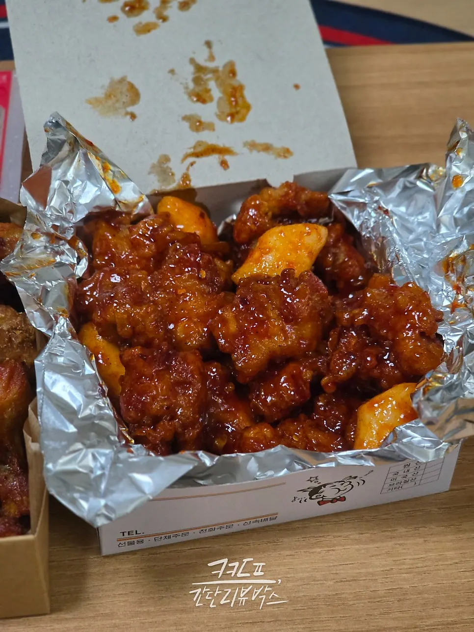 Medium dakgangjeong box packed with rice cake included