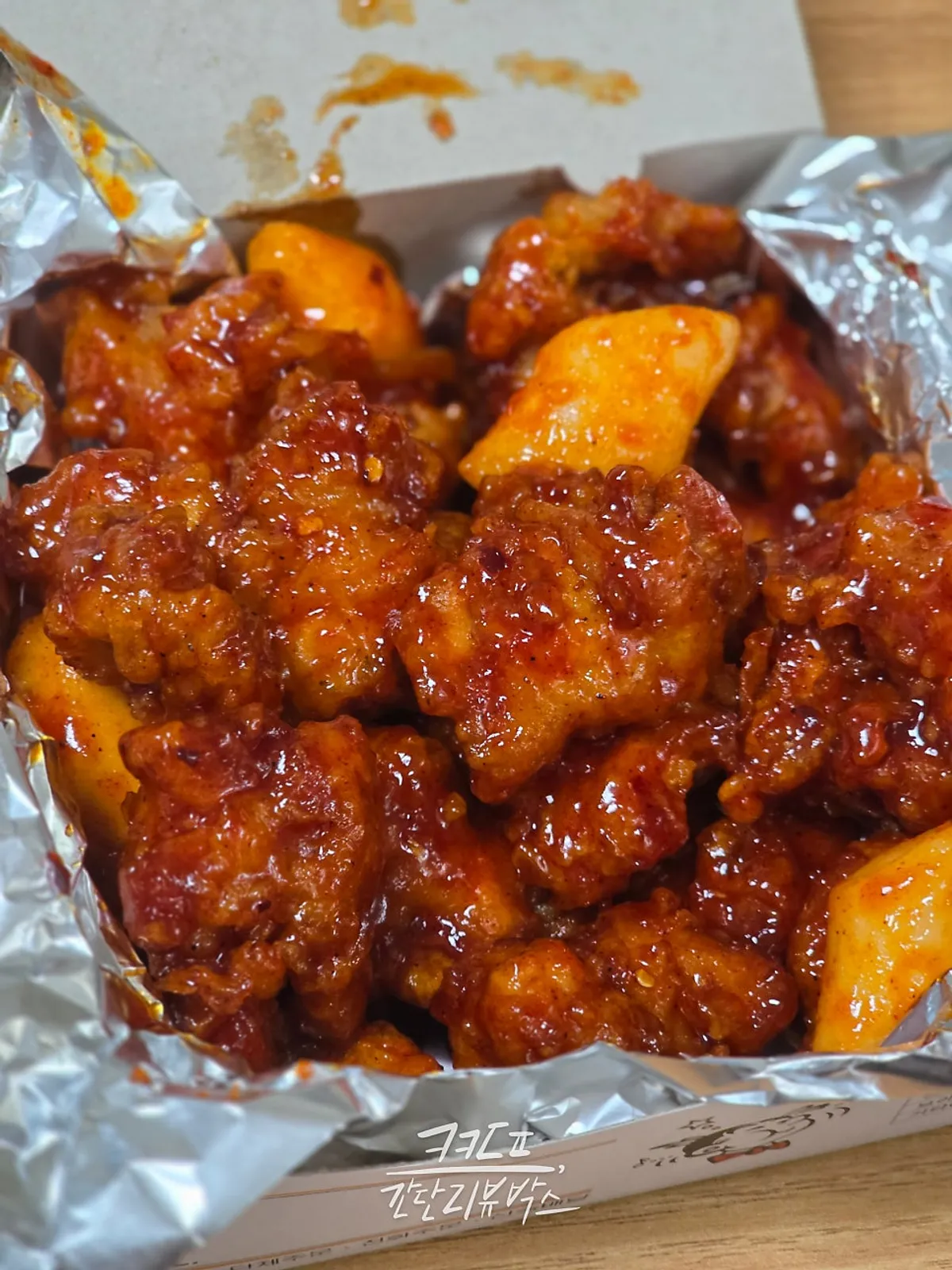 Mild dakgangjeong evenly coated in sauce