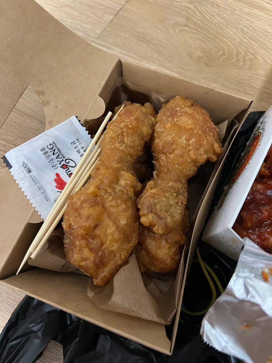 Opened lid revealing extra-large medium-spicy dakgangjeong