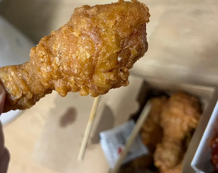Large fried drumstick the size of a whole-chicken piece